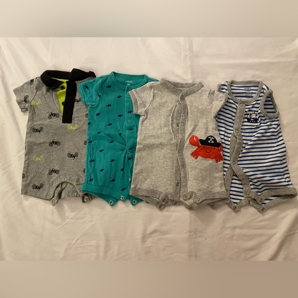 Carter’s Short sleeve rompers | Size: Newborn